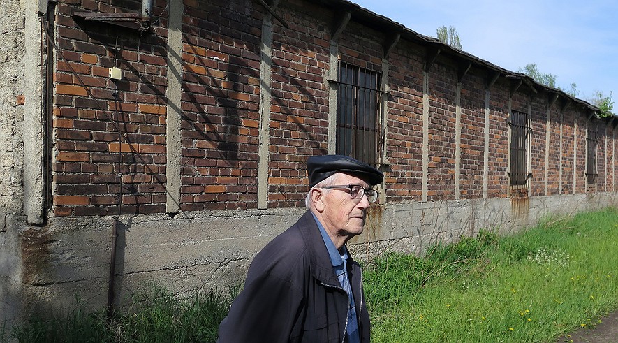 Lothar Czossek, 86, in Remsdorf just outside of Troeglitz, Germany, said that being home to a branch of the Buchenwald concentration camp should have taught area residents the importance of the needs of others. Here he is standing near the old camp barracks on April 29, 2015.