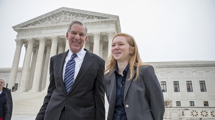 Abigail Fisher (right), who challenged the use of race in college admissions, walks with her lawyer, Bert Rein, outside the Supreme Court in Washington, D.C., Dec. 9, 2015, following oral arguments in the Supreme Court in a case that could cut back or even eliminate affirmative action in higher education.