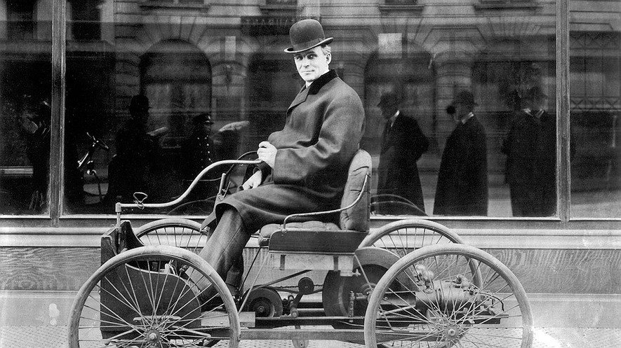 Henry Ford sits in his first automobile, the Ford Quadricycle, in 1896. Also called a horseless carriage, it sold for $200.