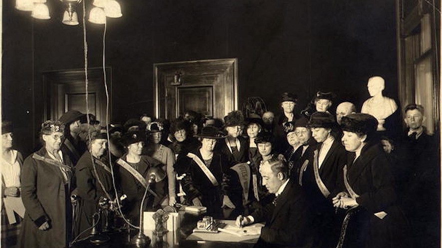 Surrounded by members of the Kentucky Equal Rights Association, Kentucky Governor Edwin P. Morrow signs the bill ratifying the 19th Amendment on January 6, 1920, giving women the right to vote.