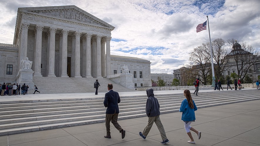 Visitors arrive at the Supreme Court building in Washington, D.C. The Supreme Court on May 15, 2017, rejected an appeal to reinstate North Carolina's voter identification law that a lower court said targeted African-Americans "with almost surgical precision." AP Photo/J. Scott Applewhite