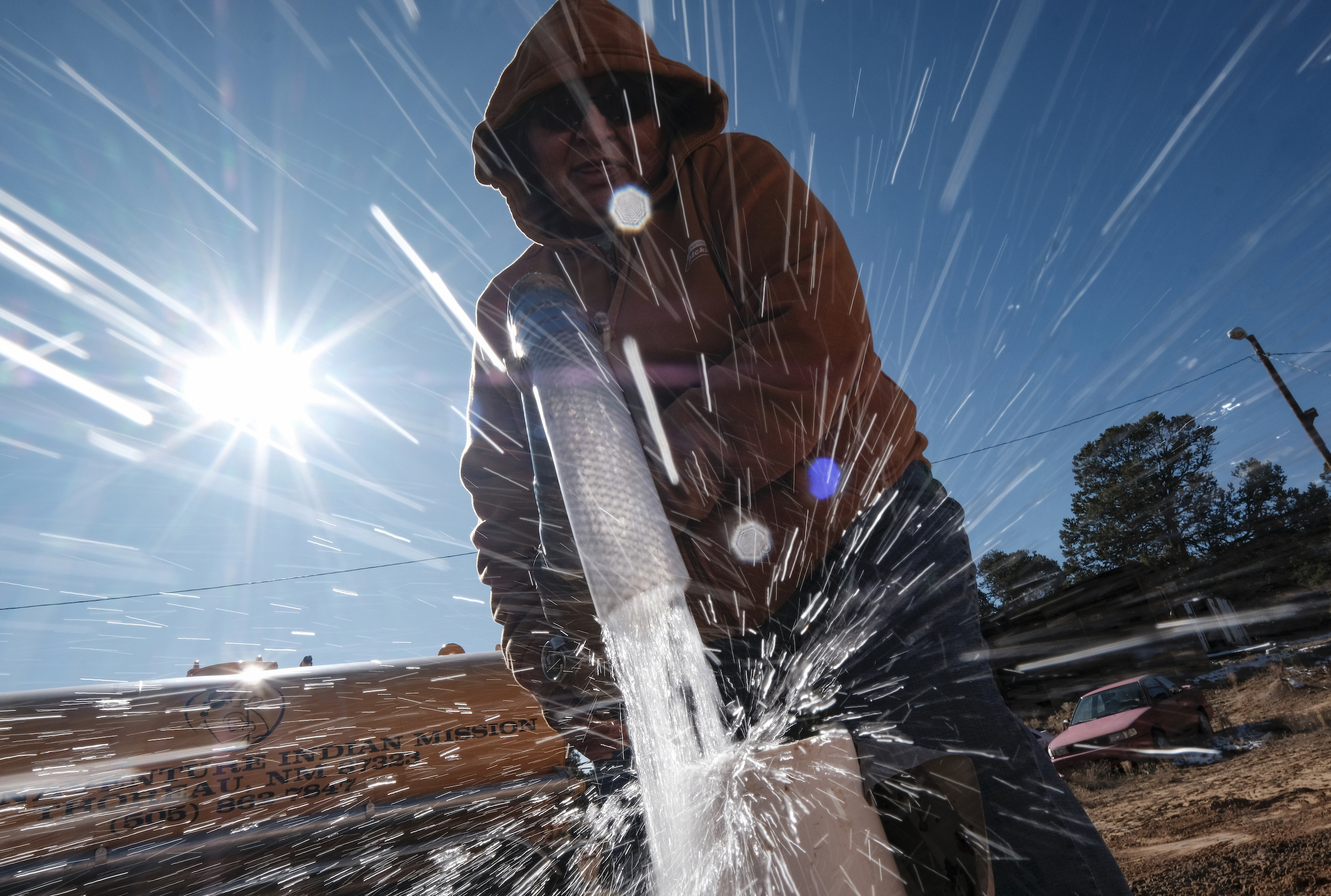 a woman sprays a hose